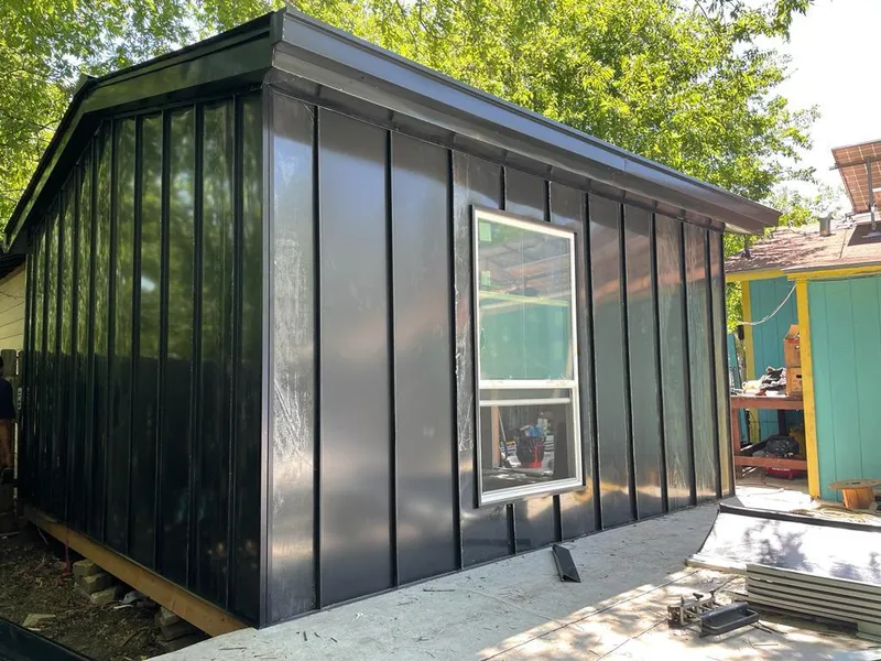 Black standing seam metal wall panels for Roof Inspection in Vincent